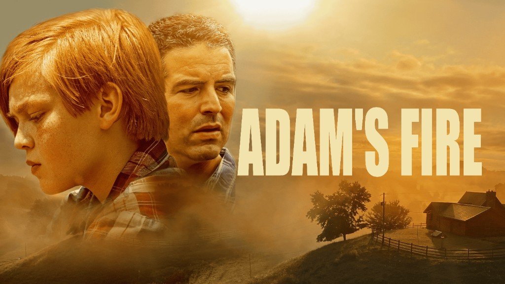 Movie poster with a young boy and a man against a misty rural landscape